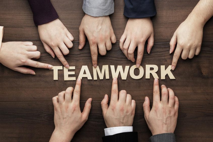 5-teamwork-concept-on-the-brown-wooden-table-background